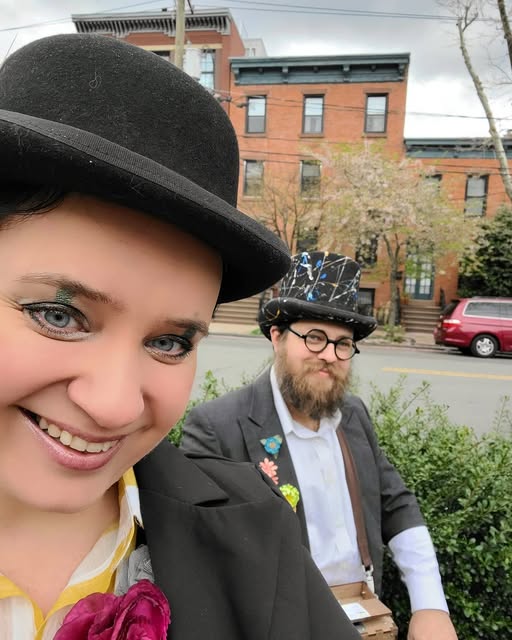 The Moobox duet smiling in their bowler and top hats.